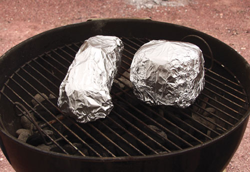 Fig.9 Place foil-wrapped, tape-decorated pots on the cooking grid rather than on the coals as the foil disintegrates in high heat.