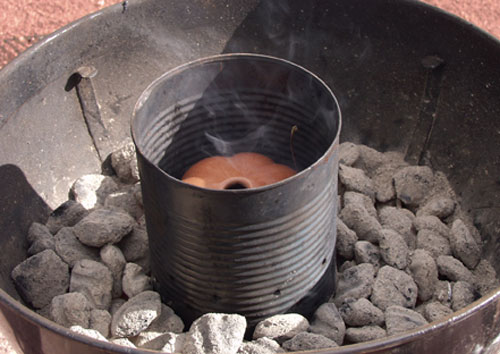 Fig.11 Place a burnished pot inside a perforated coffee can prior to firing to create an even, glossy black surface similar to the one show to the right.