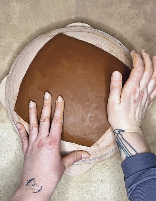 3 Cut the slab to a desired shape. Use the heel of your hand to taper the edges.