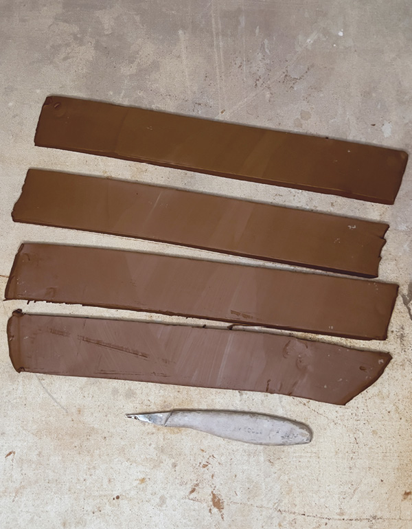 12 Cut out enough strips from the second slab you rolled out to create a rim.