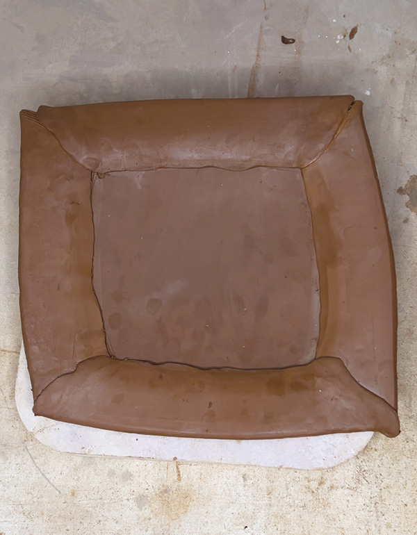 15 Compress any gaps on the top or underside of the rim/plate and foot.