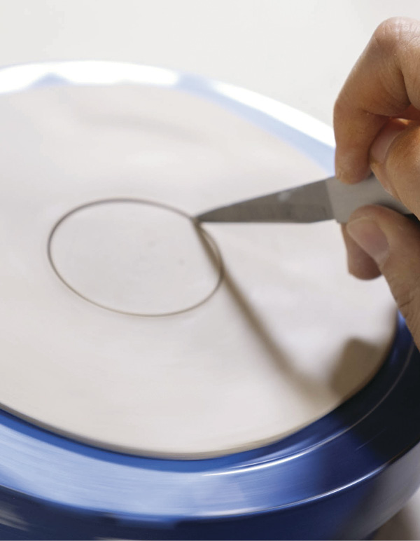 1 Roll out a thin slab, spin the wheel, and cut the slab into a circle.