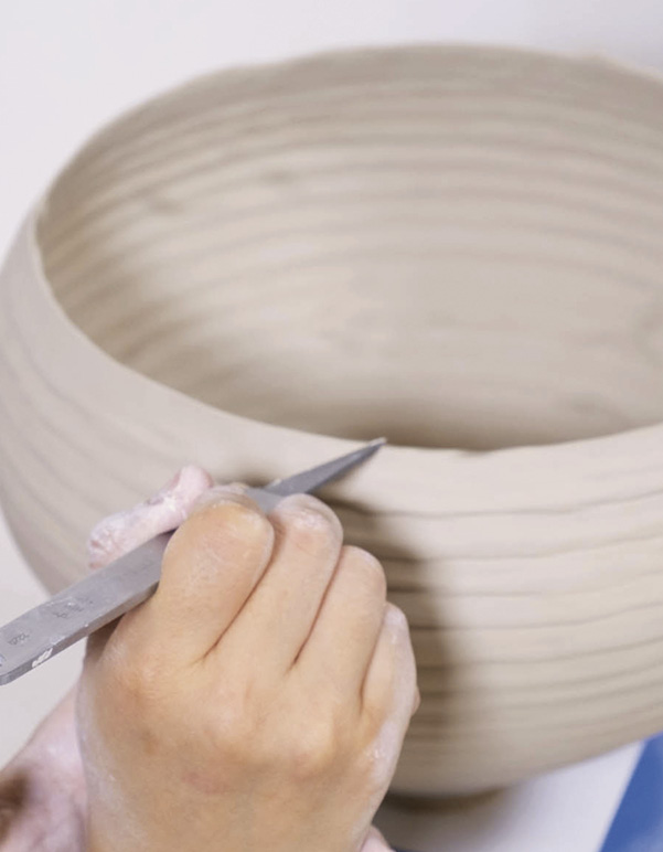 10 Repeat the process for every coil you attach. After shaping, trim the rim.