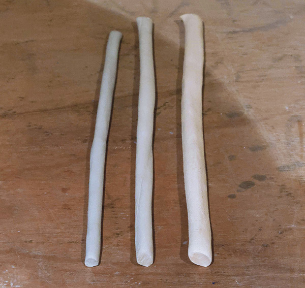 3 Roll coils of different colored clays in increasing thicknesses.