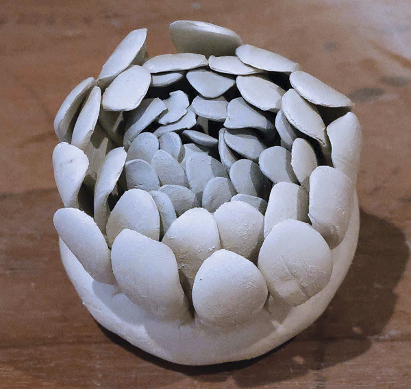 9 Attach the paler clay petals toward the outer edge of the form.
