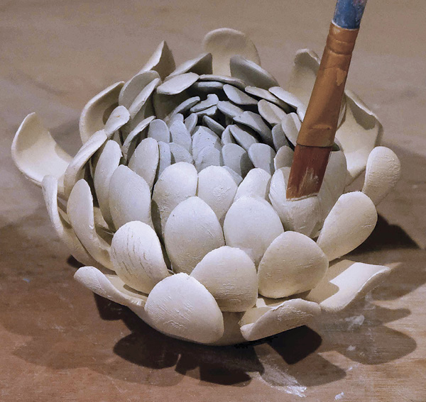 10 Clean the petals with a damp brush.