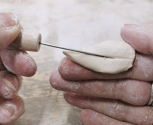 5 Carve leaf shapes and refine them with a needle tool.