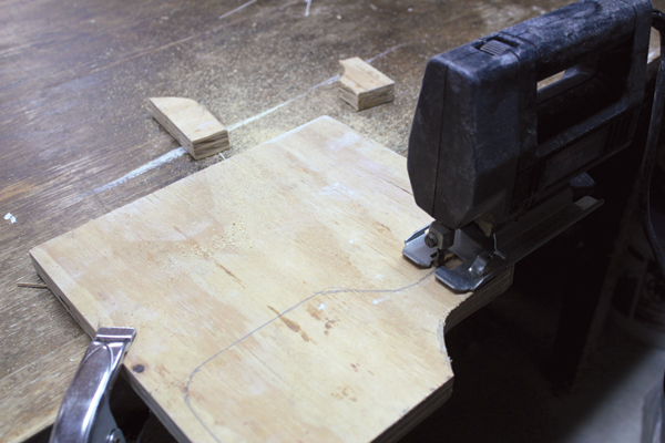 1 Draw the desired shape of the paddle on a scrap piece of plywood. Use a jigsaw to cut out the paddle shape.