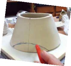 2 Create feet by cutting out an arched form on each side.