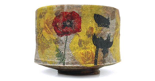 Justin Rothshank’s yunomi, wood/soda fired to cone 4, underglazes, decals refired to cone 010 and cone 015 in an electric kiln, 2019.