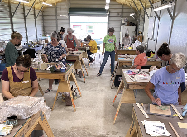 Participants working in Liz Zlot Summerfield’s 2024 workshop, “Exploring Surface Depth.” Double Island Studio, Green Mountain, North Carolina.