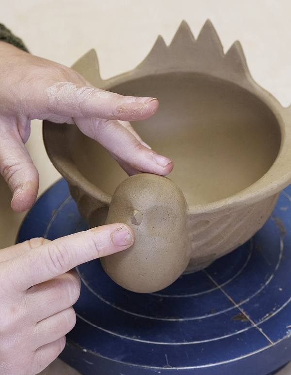 14 To create the beak, pinch clay into a point and blend the edges into place.