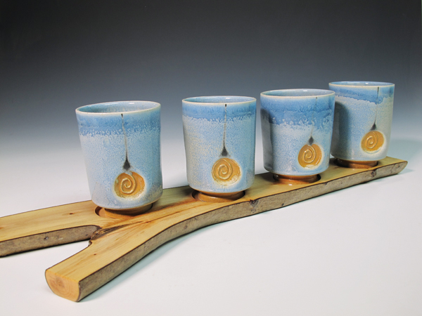 Tumbler set, 20 in. (51 cm) in length, wheel-thrown and handbuilt white stoneware, off-white terra sigillata, black slip trailing, variation of Bruce Dehnert’s Celadon, fired to cone 11–12, 2018.