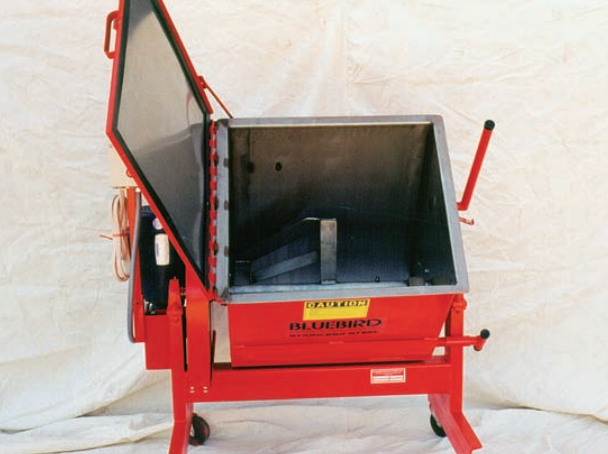 An example of a horizontal mixer. The hopper on this model from Bluebird Mfg. tilts forward to aid in emptying the machine once the batch has been mixed.